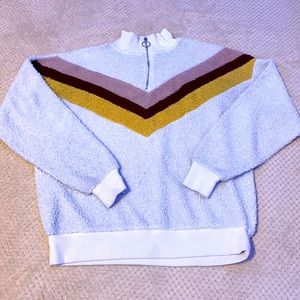 White pull over with design.